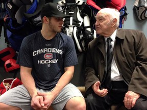 Former Canadiens goaltender Charlie Hodge, who played for the Habs from the early 1950s through 1966-67, chats with Montreal goalie Dustin Tokarski in the Canadiens' Rogers Arena dressing room in Vancouver on Oct. 30, 2014. Hodge scouted Tokarski for Tampa Bay in the mid-2000s, convincing the Lightning to draft him in 2008. The two had never met until Hodge, 81, was invited to the Canadiens' morning skate.