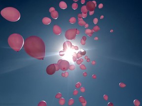 Balloons fly over the Yemeni capital Sanaa on October 30, 2013 on the occasion of the annual Breast Cancer Awareness Month campaign.