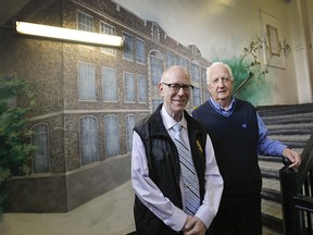 Sid Stevens, left, and Earl de la Perralle standing in front of a mural showing former Baron Byng High School, which Sun Youth calls home.