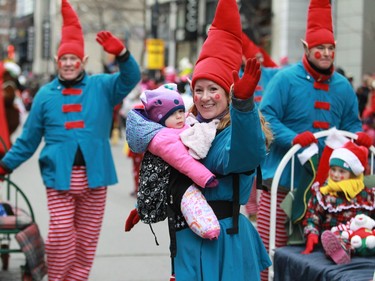 Elves and youngsters take part in the 64th edition of the Santa Claus parade in downtown Montreal on Saturday, Nov. 22, 2014.