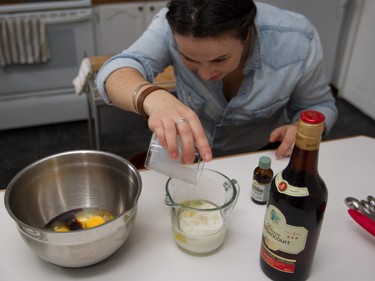 Preparing  eggs, vanilla, remaining oil and milk before whisking together to add to mix for a rum cake to made by Liz Vargas in Montreal Tuesday, November 4, 2014. Vargas is a Montreal woman who has started a business dedicated to them.