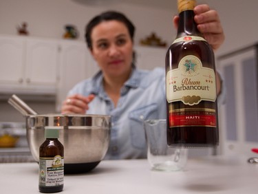 Liz Vargas with a Haiitan rum that she used to make her rum cake.