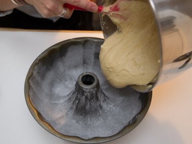 Batter for rum cake by Liz Vargas is put into a cake pan in Montreal Tuesday, November 4, 2014. Vargas is a Montreal woman who has started a business dedicated to them.