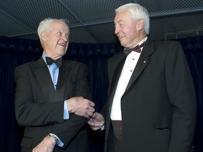 Gordie Howe shows fellow Hall of Famer Jean Béliveau how sharp his elbow still is prior to black-tie gala in Béliveau's honour at the Bell Centre on March 29, 2007.