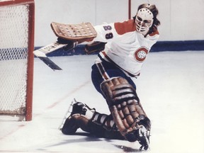 Canadiens goalie Ken Dryden makes a kick save during a 1970s game at the Montreal Forum.