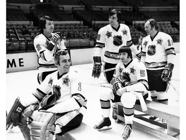 A group of future NHL Hall of Famers await a team photo before a 1970s All-Star Game. From left: Brad Park, goalie Eddie Giacomin, and Canadiens' Serge Savard, Guy Lapointe (sitting) and Yvan Cournoyer.