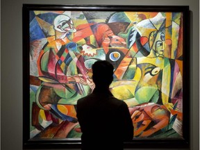 A patron looks at Heinrich Campendonk's "Harlequin and Columbine" at the "From Van Gogh to Kandinsky: Impressionism to Expressionism" exhibit at the Montreal Museum of Fine Arts. The exhibit runs until Jan. 25, 2015.