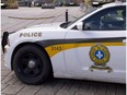 A Surete du Quebec cruiser guards the front of the National Assembly after a gunman opened fire in Ottawa on parliament Hill, on Wednesday, October 22, 2014 at the legislature in Quebec City. The Quebec legislature was scene of a multiple shooting 30 years ago, when Cpl. Denis Lortie killed three government employees and wounded 13 others.