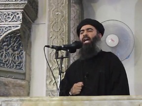 Image made from video posted on a militant website July 5, 2014, authenticated based on its contents and other AP reporting, purports to show the leader of the Islamic State group, Abu Bakr al-Baghdadi.