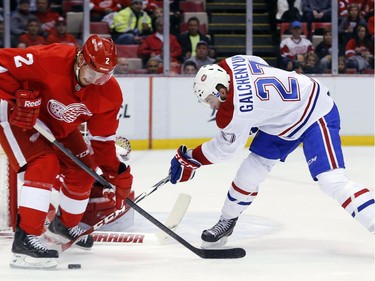 Montreal Canadiens center Alex Galchenyuk (27) tries to shoot as Detroit Red Wings defenseman Brendan Smith (2) defends in the second period of an NHL hockey game in Detroit Sunday, Nov. 16, 2014.