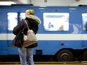 Commuters board the STM métro train at the Berri-UQAM station in Montreal April 3, 2013.