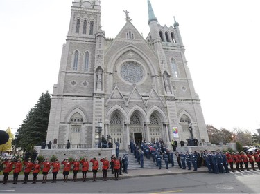 An honour guard stands at attention as warrant officer Patrice Vincent's casket is brought into a cathedral in Longueuil, Saturday, Nov. 1, 2014.The 53-year-old Vincent was killed after being hit by a car driven by an attacker with known jihadist sympathies on Oct. 20 in the parking lot of a shopping mall in Saint-Jean-sur-Richelieu, southeast of Montreal.