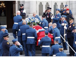 An honour guard stands at attention as warrant officer Patrice Vincent's casket is brought into St-Antoine-de-Padoue Co-Cathedral in Longueuil on Saturday, Nov. 1, 2014. The 53-year-old Vincent was killed after being hit by a car driven by an attacker with known jihadist sympathies on Oct. 20.