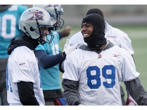 Montreal Alouettes wide receiver Duron Carter, right, shares a laugh with wide receiver Brandon London during a practice Friday, November 14, 2014 in Montreal. The Alouettes will face the B.C. Lions in the CFL Eastern Semi Final Sunday.
