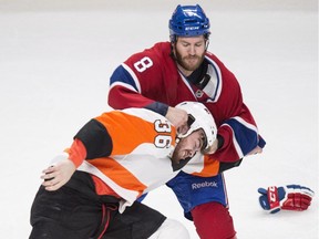 Montreal Canadiens' Brandon Prust and Philadelphia Flyers' Zac Rinaldo fight during the second period of their NHL hockey game in Montreal on Saturday, Nov. 15, 2014.