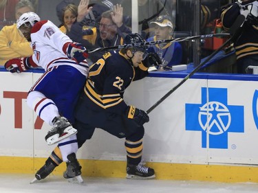 Buffalo Sabres' Johan Larsson and Montreal Canadiens' P.K. Suban collide during the first period on Wednesday, Nov. 5, 2014, in Buffalo, N.Y.