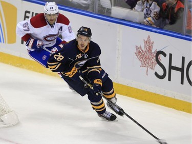 Buffalo Sabres' Zemgus Girgensons skates past Montreal Canadiens' Max Pacioretty during the second period on Wednesday, Nov. 5, 2014, in Buffalo, N.Y.