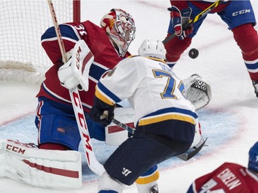 Montreal Canadiens goalie Carey Price stops St. Louis Blues' T.J. Oshie during second period NHL hockey action Thursday, November 20, 2014 in Montreal.