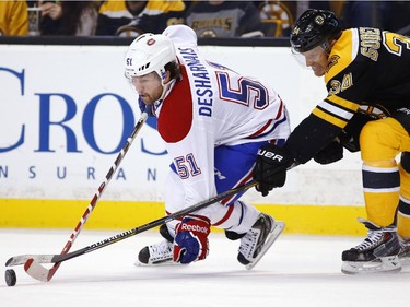 Boston Bruins' Carl Soderberg (34) tries to check Montreal Canadiens' David Desharnais (51) during the third period of Montreal's 2-0 win in an NHL hockey game in Boston, Saturday, Nov. 22, 2014.