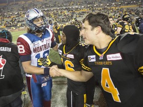Alouettes quarterback Jonathan Crompton shakes hands with Tiger-Cats QB Zach Collaros following CFL game in Hamilton on Nov. 8, 2014. The Tiger-Cats won 29-15 to become the East Division regular-season champions.