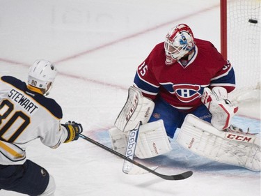 Buffalo Sabres' Chris Stewart scores against Montreal Canadiens goaltender Dustin Tokarski during third period NHL hockey action in Montreal, Saturday, November 29, 2014.