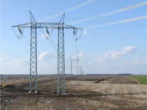 A Hydro tower in a field.