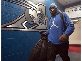 Montreal Alouettes defensive end D.J. Roberts leaves the locker room as the team clears out their lockers Monday, Nov. 24, 2012 in Montreal. The Hamilton Tiger-Cats defeated the Alouettes 40-24 to advance to the Grey Cup game in Vancouver.