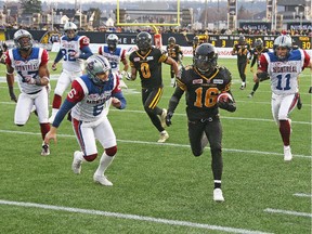 HAMILTON, ON - NOVEMBER 23:  Brandon Banks #16 of the Hamilton Tiger-Cats breaks a return for a touchdown against the Montreal Alouettes during the CFL football Eastern Conference Final at Tim Hortons Field on November 23, 2014 in Hamilton, Ontario, Canada. The Tiger-Cats defeated the Alouettes 40-24.