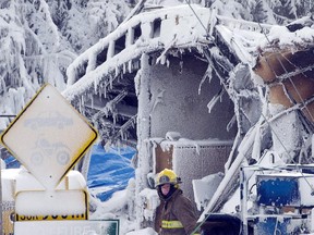 Emergency workers resume the search for victims at a fatal seniors residence fire, Sunday, Jan. 26, 2014 in L'Isle-Verte, Que.