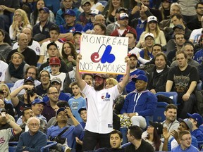 A Montreal fan shows his Expos colours as the Toronto Blue Jays play the New York Mets in a preseason game at Olympic Stadium on March 28, 2014.