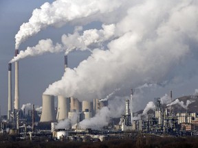 FILE - In this Dec. 16, 2009 file photo, steam and smoke rises from a coal power station in Gelsenkirchen, Germany. Scientists are more confident than ever that pumping carbon dioxide into the air by burning fossil fuels is warming the planet. By how much is something governments and scientists meeting in Stockholm will try to pin down with as much precision as possible Friday Sept. 27, 2013 in a seminal report on global warming.
