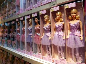 Barbie dolls sit on the shelf, at the Toys 'R Us Times Square flagship store in New York in 2012.