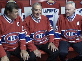 Former Canadiens Serge Savard, Guy Lapointe and Larry Robinson, known as the Big Three, pose together after a news conference on June 19, 2014, announcing that the club would retire Lapointe's No. 5.