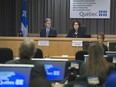 Justice France Charbonneau, right, alongside commissioner Renaud Lachance delivers her closing remarks on the final day in Montreal Friday, November 14, 2014 of the Charbonneau Commission, a Quebec inquiry looking into allegations of corruption in the province's construction industry.