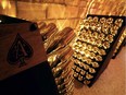 Bottles of "Armand de Brignac" Champagne, with the brand's ace-of-spades insignia (L), are seen in the cellars of the Cattier champagne family house on November 6, 2014 in Chigny-les-Roses, south of Reims, northeastern France.  Hip-hop mogul Jay Z has shown his fondness for Armand de Brignac Champagne for years and on November 5, 2014 he bought the brand. Sovereign Brands, a New York-based wine and spirits company which owned the label, said it was selling it to Jay Z for an undisclosed amount.