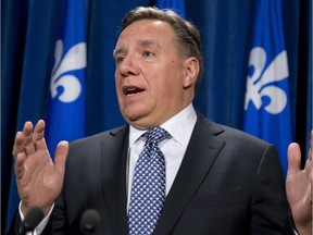 Coalition Avenir Québec Leader François Legault responds to reporters questions Tuesday, September 16, 2014 at the legislature in Quebec City.