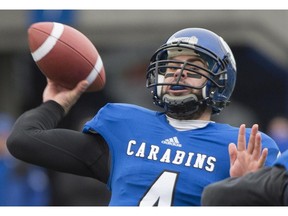 Montreal Carabins quarterback Gabriel Cousineau throws a pass during first half CIS university football semifinal action against the Manitoba Bisons in Montreal, Saturday, November 22, 2014.