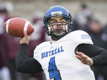 Montreal Carabins quarterback Gabriel Cousineau throws a pass against the McMaster Marauders during second half CIS Vanier Cup football action in Montreal Saturday, November 29, 2014.