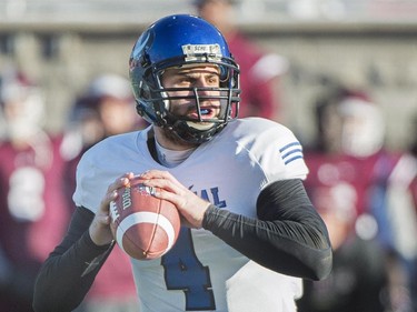 Montreal Carabins quarterback Gabriel Cousineau sets up a play against the McMaster Marauders during first half CIS Vanier Cup football action in Montreal Saturday, November 29, 2014.