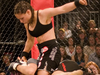 Two MMA fighters in action: The Gina Carano ground and pound.