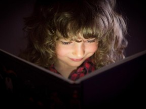 A child reading a book.