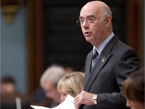 Quebec Economy, Innovation and Exports Minister Jacques Daoust tables legislation Wednesday, November 12, 2014 at the legislature in Quebec City.