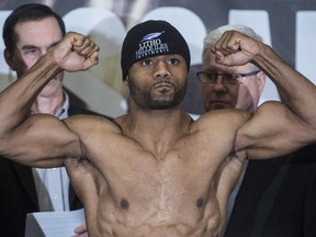 Jean Pascal flexes his muscles during a weigh-in on Jan. 17, 2014 in Montreal.