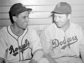 Jean-Pierre Roy of the Montreal Royals, left, and Hugh Casey of the Brooklyn Dodgers, right, on July 9, 1946.
