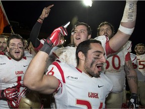Laval Rouge et Or celebrate after winning the Uteck Bowl at MacAulay Field in Sackville, N.B. on Saturday, Nov. 16, 2013. Laval advanced to the RSEQ final with a 74-18 win over the Concordia Stingers on Saturday, November 8, 2014.