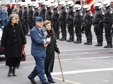 Lt. Col. Gilbert McCauley escorts warrant officer Patrice Vincent's mother Guerette Vincent into St-Antoine-de-Padoue Co-Cathedral in Longueuil on Saturday, Nov. 1, 2014. Warrant officer Patrice Vincent was killed after being hit by a car driven by an attacker with known jihadist sympathies on Oct. 20.
