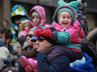 Three-year-old Eva Gomez, with her father Manuel, was excited to be at the 64th edition of the downtown Santa Claus parade in on Ste- Catherine St. in Montreal Saturday, November 22, 2014.