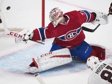 Montreal Canadiens goaltender Carey Price makes a save against Chicago Blackhawks' Marian Hossa during second-period action in Montreal, Tuesday, Nov., 2014.