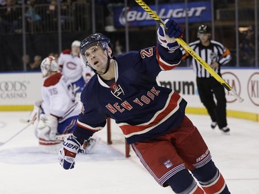 New York Rangers' Martin St. Louis reacts after scoring during the second period of the NHL hockey game against the Montreal Canadiens, Sunday, Nov. 23, 2014, in New York.