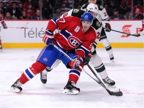 The Canadiens' Max Pacioretty battles for position with the Minnesota Wild's Ryan Suter during game at the Bell Centre on Nov. 8, 2014.